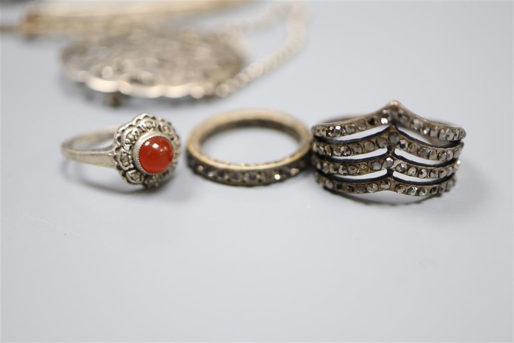 Mixed jewellery including silver brooch and white metal bracelets.